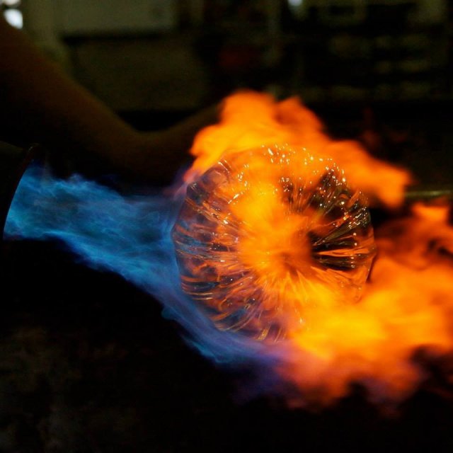 glass pumpkin engulfed in torch flames